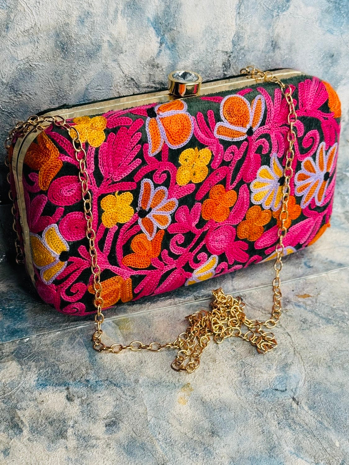 EMBROIDERED VELVET PURSE ON A DARK GREEN BACKGROUND WITH PINK ORANGE AND GOLD