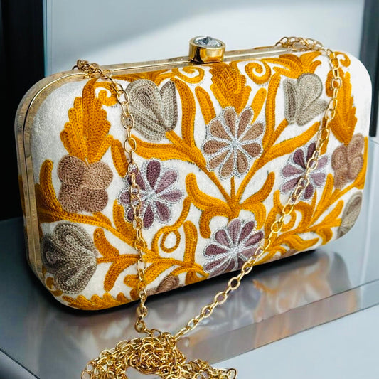 EMBROIDERED VELVET PURSE ON A CREAM BACKGROUND WITH LIGHT RUST  AND GRAY FLORAL COMBINATION